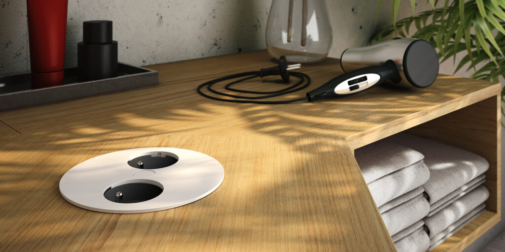 Witte twist met twee stopcontact opties in 1 ronde stekkerdoos voor in de tafel
